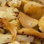 roasted cauliflower and garlic, sprinkled with ground pepper